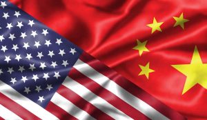 China and America : two national flags face to face, symbol for the relationship between the two countries.