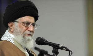 Iranian Supreme Leader Ayatollah Ali Khamenei listens during a meeting with a group Qom residents.